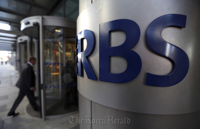 A visitor enters the headquarters of the Royal Bank of Scotland Group in London. (Bloomberg)