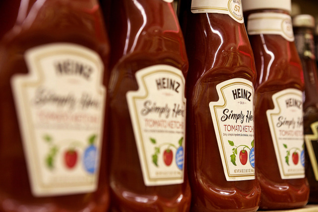 Bottles of H.J. Heinz Co. ketchup products are displayed on a shelf for sale at grocery store in Pittsburgh, Pennsylvania,Thursday. (Bloomberg)