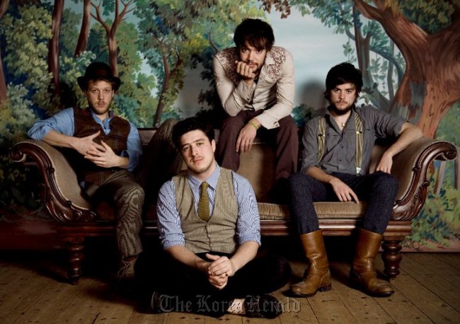 The four members of the popular British folk band Mumford & Sons.