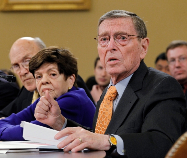 In a Tuesday, Nov. 1, 2011 file photo, former Senate Budget Committee Chairman Pete Domenici, R-N.M., right, speaks before the Joint Select Committee on Deficit Reduction during a hearing on Capitol Hill in Washington. (AP-Yonhap News)