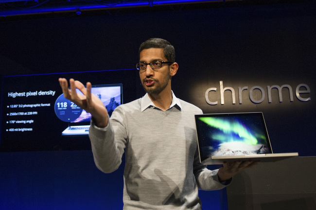 Sundar Pichai, senior vice president of Chrome at Google, holds up the new Chromebook Pixel on Thursday. (Bloomberg)