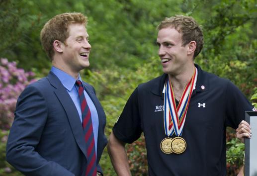 Prince Harry talks with Capt. Simon Maxwell, British Royal Marines, Wound Warriors Games medalist during a reception for U.S. and British wounded warriors at the British Ambassador`s Residence in Washington, D.C. on May 7, 2012. (UPI)