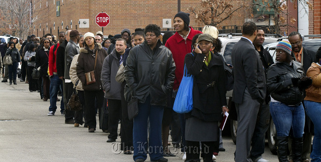 Job seekers stand in line to enter the City of Chicago job fair at Kennedy King College in Chicago, Illinois. (Bloomberg)