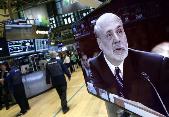 Federal Reserve Chairman Ben Bernanke is seen on a monitor on the floor of the New York Stock Exchange on Tuesday. (AP-Yonhap News)