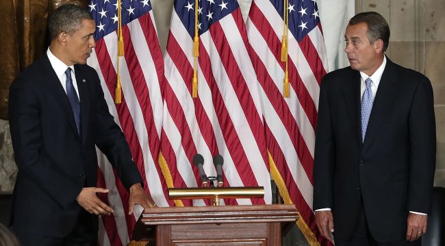 U.S. President Barack Obama (left) and Speaker of the House John Boehner take part in a ceremony to unveil a statue honoring the late civil rights activist Rosa Parks in Statutory Hall of the U.S. Capitol in Washington, D.C. on Wednesday. (AFP-Yonhap News)