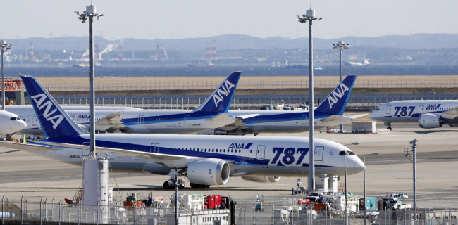 All Nippon Airways’ Boeing 787 Dreamliner passenger jets are parked on the tarmac at Haneda airport in Tokyo. (AP-Yonhap News)