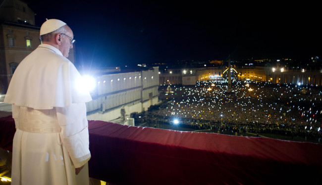 Pope Francis looks at the crowd from the central balcony of St. Peter’s Basilica at the Vatican on Wednesday. (AP-Yonhap News)