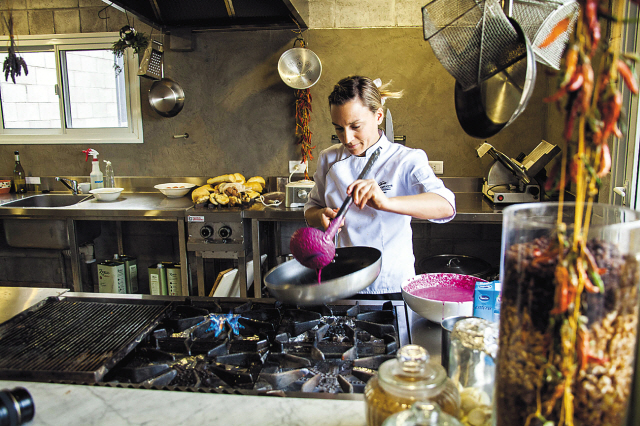 Chef Ana Rodriguez prepares traditional dishes at the Pan y Oliva cafe at the Zuccardi Winery in Mendoza, Argentina. (Stever Haggerty/MCT)