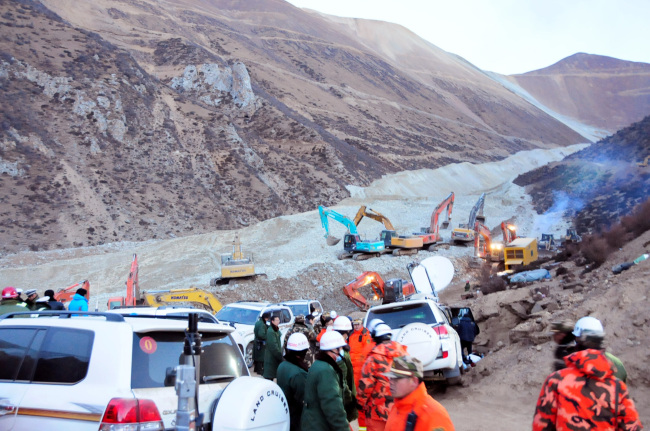 Rescuers work at the site where a landslide hit a mining area in Maizhokunggar County of Lhasa, the capital of southwest China’s Tibet Autonomous Region, Saturday. (AP-Yonhap News)