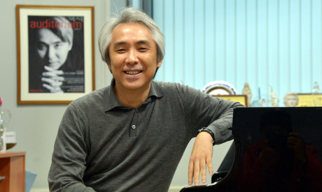 Kumho Art Hall Music Society music director Kim Dae-jin poses for The Korea Herald at his office at the Korea National University of Arts in southern Seoul on Thursday. (Kim Myung-sub/The Korea Herald)