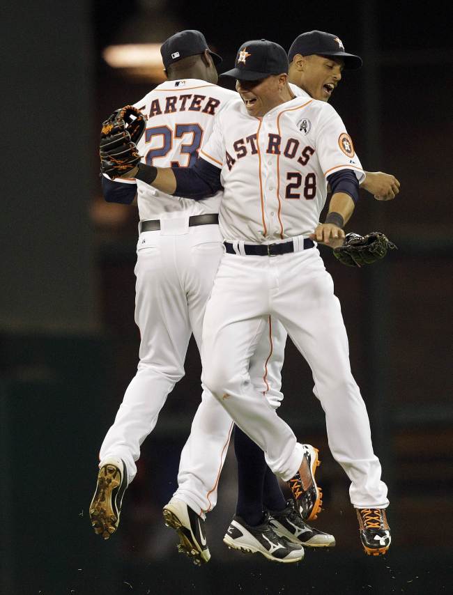 Houston Astros outfielders celebrate after the final out on Sunday. (AFP-Yonhap News)