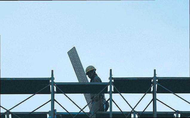 A worker at a construction site for a hospital in Tokyo. (Bloomberg)