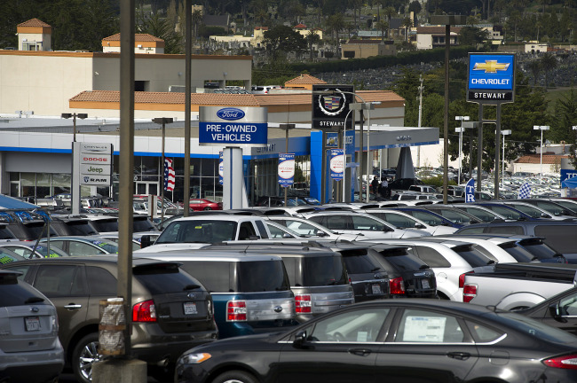 Signage for car dealerships is seen in Colma, California, Friday. (Bloomberg)