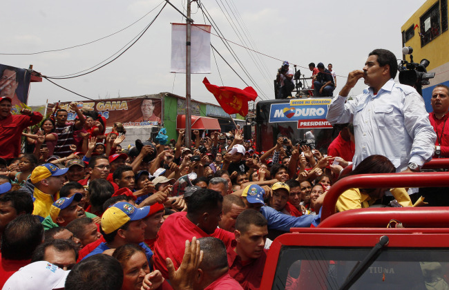 Venezuela’s interim President Nicolas Maduro blows a kiss to supporters from the top of a vehicle as he campaigns in a caravan from Sabaneta to Barinas, in Sabaneta, Venezuela, Tuesday. (AP-Yonhap News)