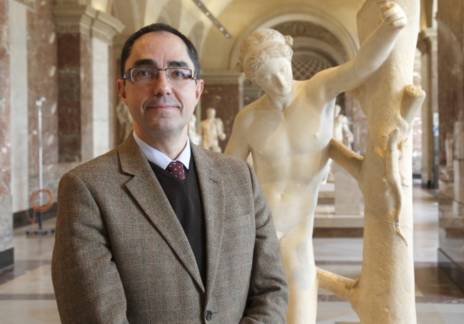 Jean-Luc Martinez poses for a photograph in the Louvre in this undated photo provided by the Louvre museum, Paris. (AP-Yonhap News)