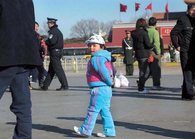 A child walks through Tiananmen Square in Beijing. (Bloomberg)