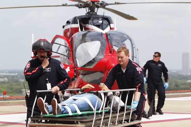 Life Flight personnel rush a victim wounded in a stabbing attack on the Lone Star community college system’s Cypress, Texas campus into Memorial Hermann Hospital in Houston on Tuesday. (AP-Yonhap News)