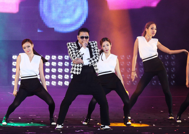 Psy performs his newest single “Gentleman” live for the first time at his solo “Happening” concert on Saturday night at the Seoul World Cup Stadium. (Yonhap News)