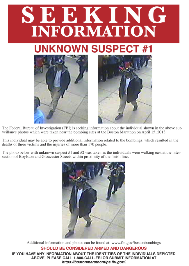 This poster released by the FBI on Thursday, April 18, 2013, shows what the FBI are calling suspect number 1, wearing a black cap, walking through the crowd in Boston on Monday. (AP-Yonhap News)