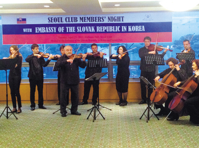 The Slovak Chamber Orchestra and conductor Danel Ewald (center) perform for guests during the SlovakEmbassy’s “Slovak Night” at the Seoul Club on Tuesday. (Philip Iglauer/The Korea Herald)