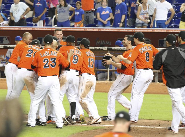 Miami Marlins celebrate after defeating the New York Mets in 15th inning of the game at the Marlins Park in Miami on Monday. (AP-Yonhap News)