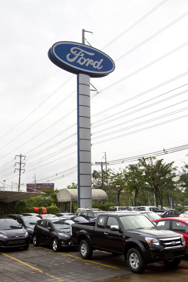 Cars sit outside a Ford Motor Co. dealership in Bangkok. (Bloomberg)