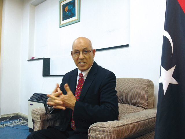 Libyan Charge d’Affaires to Korea Otman S.M. Daouki gestures during an interview with The Korea Herald at his office in the Yongsan district of Seoul on Monday. (Philip Iglauer/The Korea Herald)