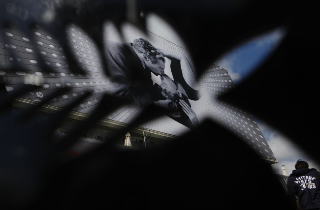 A man walks past a poster outside Palais des Festivals in Cannes, France, Tuesday. (Xinhua-Yonhap News)