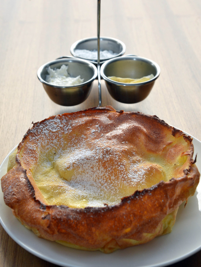 The Original Pancake House’s Dutch Baby, a souffle-like pancake dusted in powdered sugar, is served with whipped butter and lemon. (Kim Myung-sub/The Korea Herald)