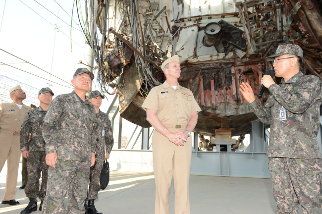 U.S. Chief of Naval Operations Adm. Jonathan W. Greenert (second from right) is briefed on the wreckage of the corvette Cheonan at the South Korean Navy’s Second Fleet in Pyeongtaek, Gyeonggi Province, Thursday. (Navy)
