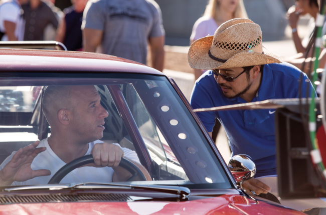 Vin Diesel (left) starring as Dom, and director Justin Lin talk on the set of “Fast & Furious 6.” (MCT)