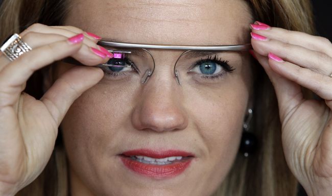 Sarah Hill, a Google Glass contest winner, reacts while trying out her device in New York on May 29. (AP-Yonhap News)