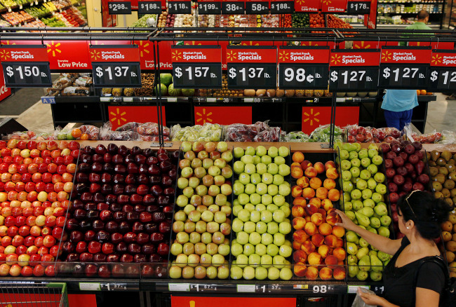 A customer shops for produce during the grand opening of a Wal-Mart Stores Inc. location in Panorama City, California. (Bloomberg)