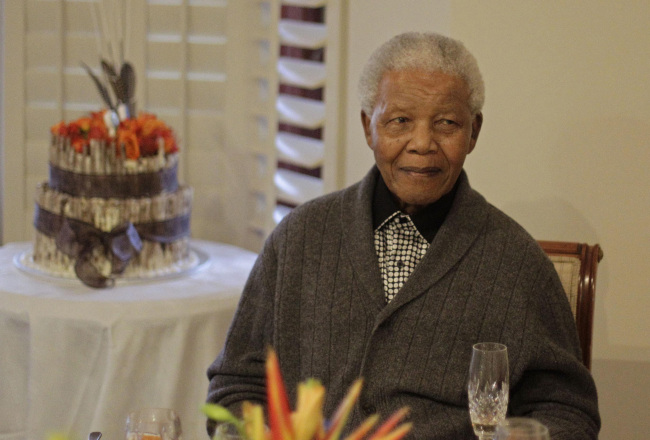 In this Wednesday, July 18, 2012 file photo, former South African President Nelson Mandela as he celebrates his 94th birthday with family in Qunu, South Africa. Nelson Mandela`s health has deteriorated and he is now in critical condition, the South African government said Sunday. (Yonhap News)