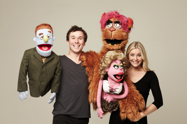 Actress Carly Anderson and actor Nicholas Duncan of “Avenue Q” pose for a photo with their character puppets in Seoul. (Seol & Company)