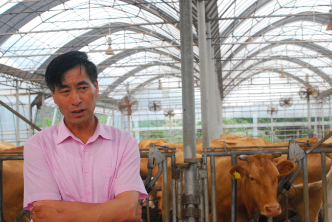 Hwang In-sik speaks during an interview with The Korea Herald at his cattle farm in Beopwon-ri, Gyeonggi Province, Friday. (Elaine Ramirez/The Korea Herald)
