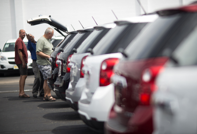 People browse through rows of cars for sale at the Jack Maxton Chevrolet dealership in Columbus, Ohio. (Bloomberg)