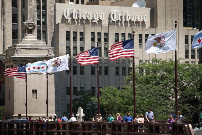 Flags fly along the Chicago Tribune Tower in Chicago, Illinois, Wednesday. ( AFP-Yonhap News)