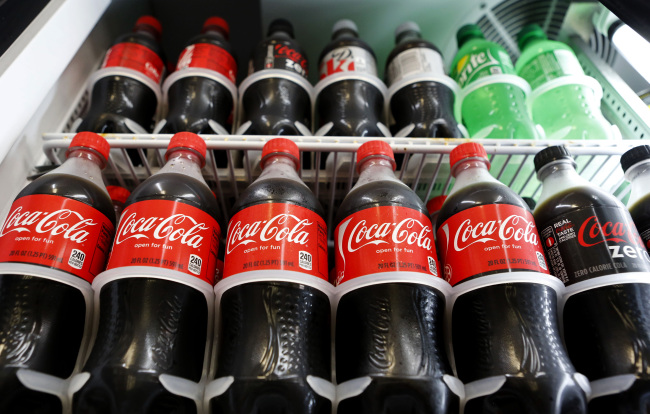 Bottles of Coca-Cola are displayed at a convenience store in Redondo Beach, California, Monday. (Bloomberg)