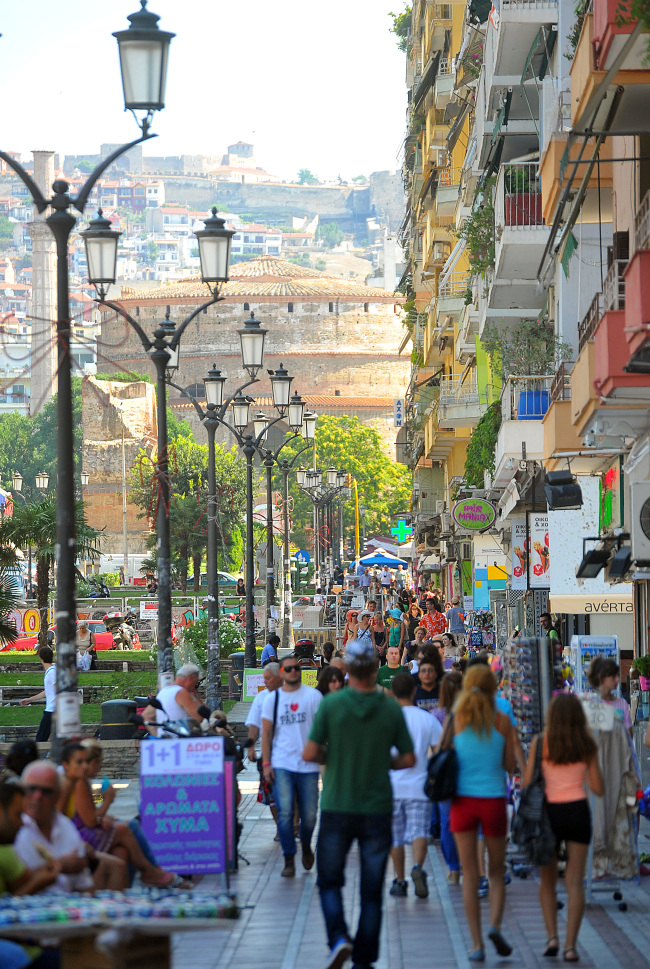 Pedestrians walk along a busy shopping street in Thessaloniki, Greece. (Bloomberg)