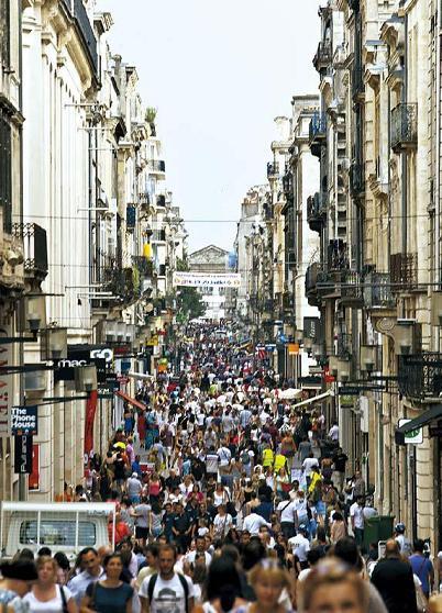 Pedestrians pass along Rue Sainte-Catherine, the main shopping street in Bordeaux, France. (Bloomberg)