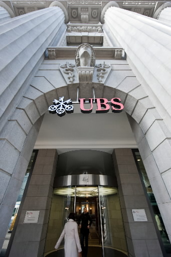 A pedestrian enters the UBS headquarters on Bahnhofstrasse in Zurich, Switzerland. (Bloomberg)