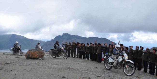 This photo provided by the North Korean Central News Agency shows New Zealand motorcycle adventurers starting a trip south through the DMZ into South Korea from Baekdusan Mountain in North Korea on Monday. (Yonhap News)