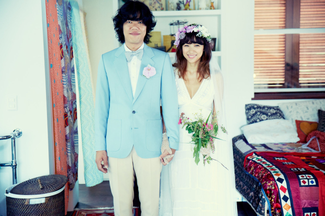 Lee Hyori and Lee Sang-soon pose at their wedding on Sept. 1 in their country home in the northern part of Jeju Island. (Hyori Together)