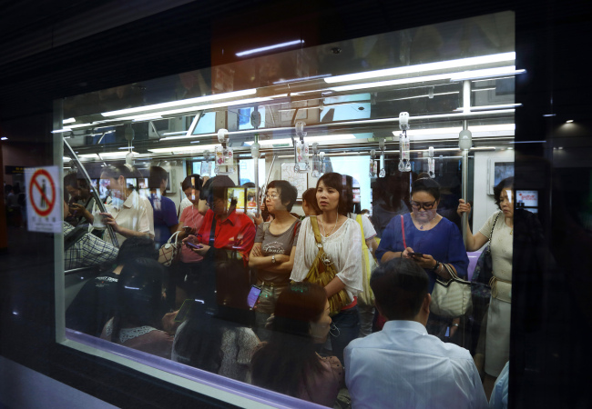 Passengers ride a subway train in Shanghai. (Bloomberg)