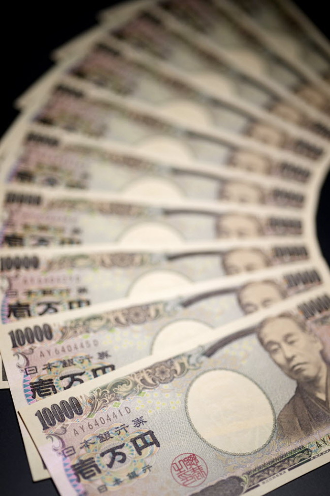 Japanese 10,000 yen banknotes are arranged for a photograph in Kawasaki, Japan. (Bloomberg)