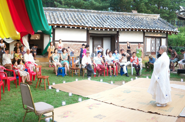 Buddhist monk and shamanistic dance master Hyein gives a presentation at Farm Cottage near Cheongpyeong Lake in Gyeonggi Province.