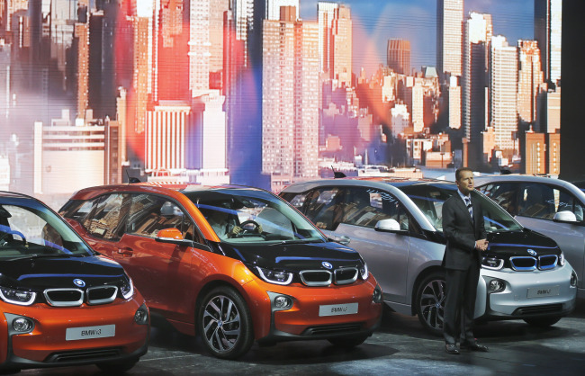 BMW development head Herbert Diess presents the new BMW i3 electric car during the first press day of the 65th Frankfurt Auto Show in Frankfurt, Germany, Tuesday. (AP-Yonhap News)