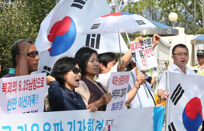 Civic activists protest North Korea’s postponement of reunions of separated families in Seoul on Monday. (Yonhap News)