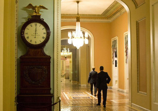 The Ohio Clock outside the Senate Chamber on Capitol Hill shows the time of 12:01 a.m. on Tuesday in Washington. (AP-Yonhap News)